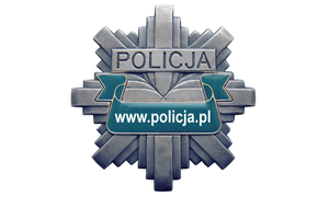 Odznaka policyjna z napisem Policja.