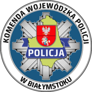 Odznaka policyjna, z napisem Komenda Wojewódzka Policji w Białymstoku.