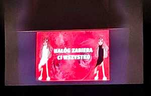 Biały napis nałóg zabiera ci wszystko na czerwonym tle.