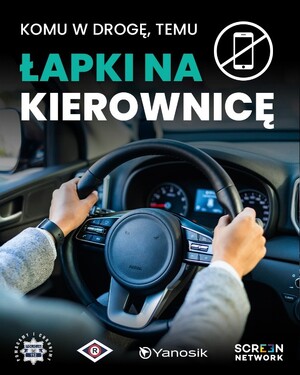 Ręce na kierownicy i napis Łapki na kierownicę.